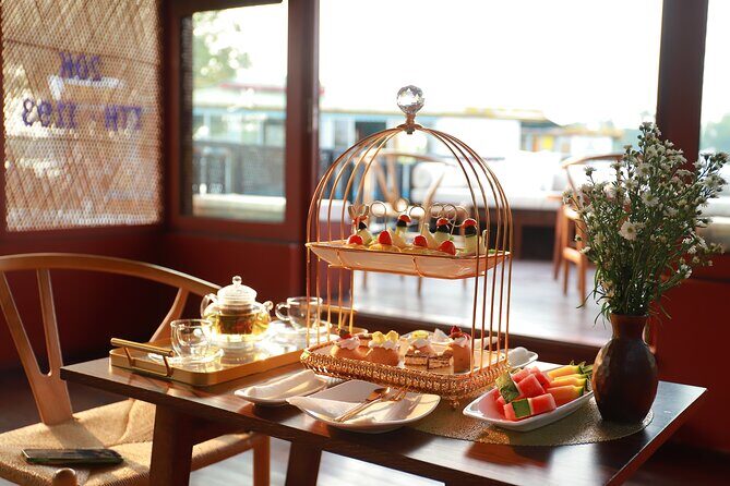 Huong River Afternoon Tea Cruise Tour Along Hue City - Trường Tiền Bridge and Hue’s riverside architecture in motion